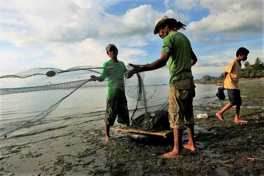 Timorese fishermen retrieving their nets after a day of fishing along the coast of Dili, Timor Leste. (SPH Media)