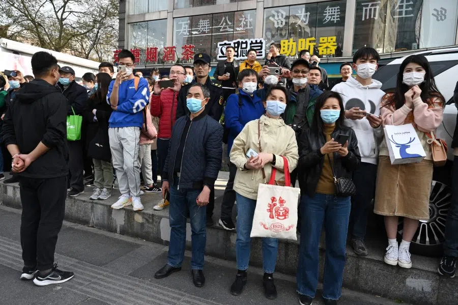 People wait for the departure of former Taiwan president Ma Ying-jeou during a visit to the former residence of John Rabe in Nanjing, in China's eastern Jiangsu province on 28 March 2023. (Greg Baker/AFP)