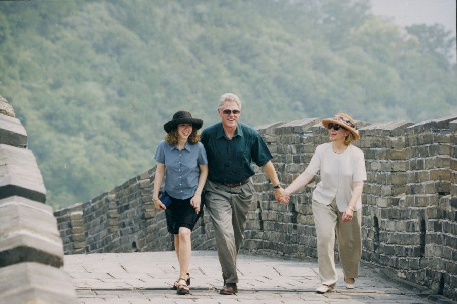 US President Bill Clinton and First Lady Hillary Clinton, and their daughter Chelsea enjoying themselves on the Great Wall, June 1998.