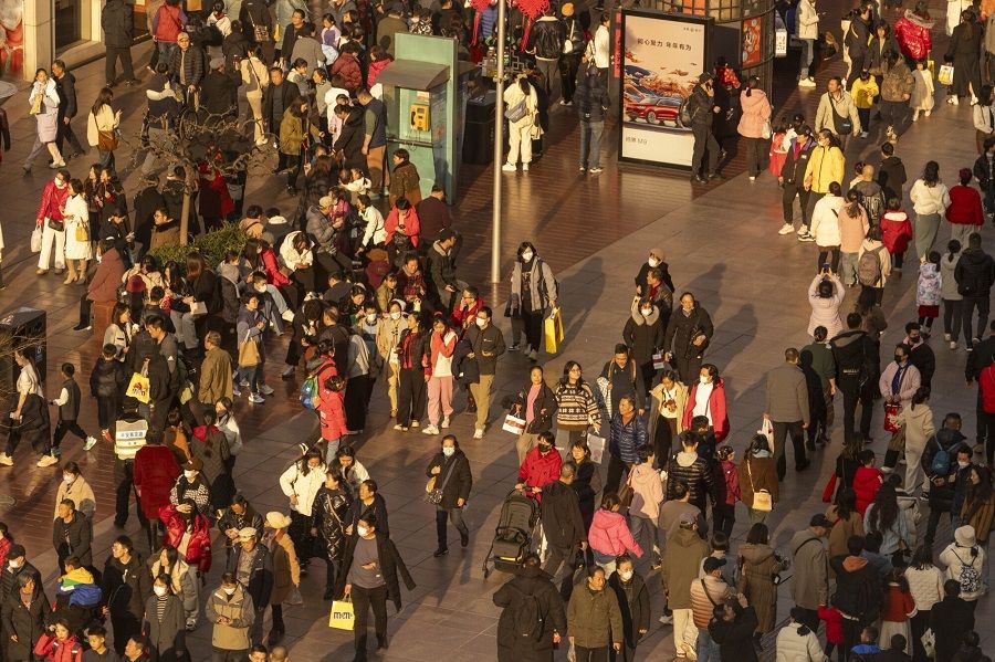 Shoppers on East Nanjing Road in Shanghai, China, on 11 February 2024. (Raul Ariano/Bloomberg)