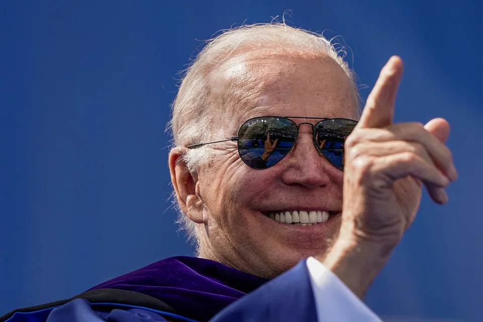 US President Joe Biden gestures during the commencement ceremony at the University of Delaware in Newark, Delaware, US, 28 May 2022. (Elizabeth Frantz/Reuters)