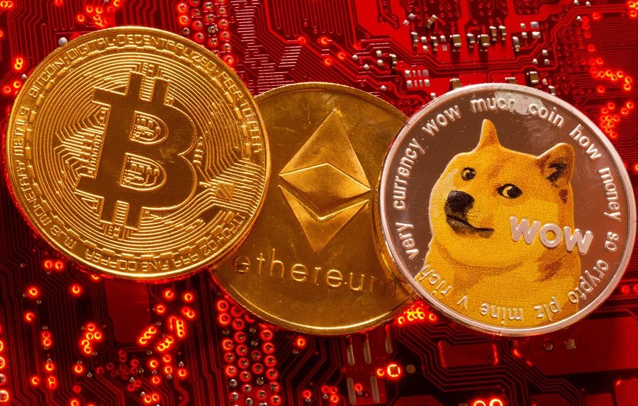 Representations of cryptocurrencies Bitcoin, Ethereum and DogeCoin are placed on PC motherboard in this illustration taken on 29 June 2021. (Dado Ruvic/Illustration/File Photo/Reuters)