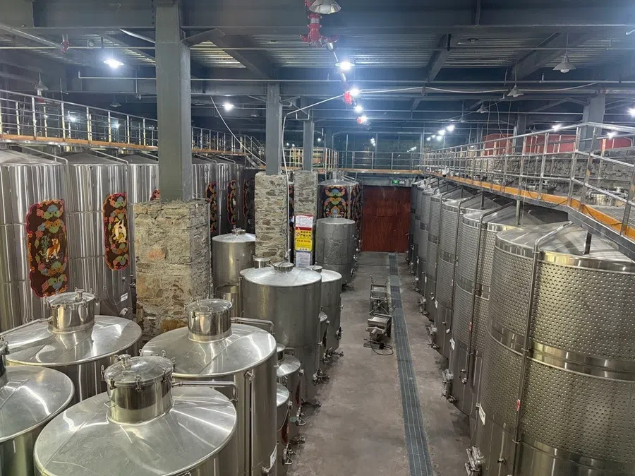 The picture shows the Pazhu Vineyard in Sangri county, on the banks of the Yarlung Tsangpo river on 29 July 2026. The stainless steel tanks in the vinyard are adorned with Tibetan-style patterns.