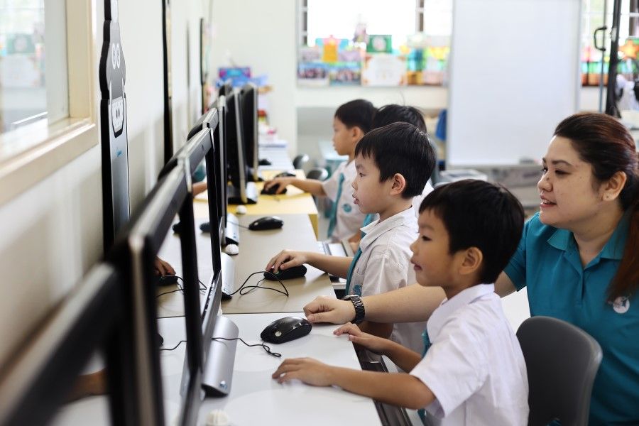 Children at ChildFirst school in Singapore using ChatGPT. (SPH Media)