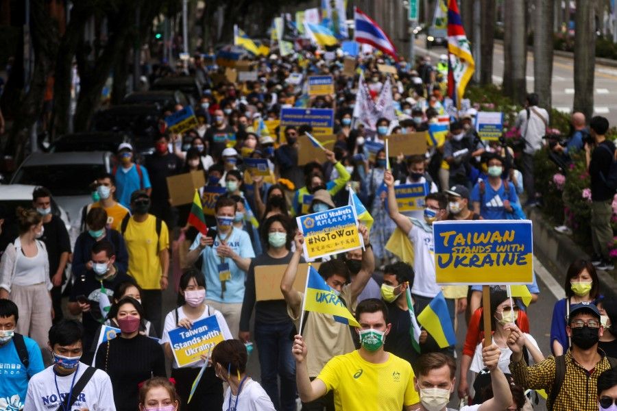 People attend a rally against Russia's invasion of Ukraine in Taipei, Taiwan, 13 March 2022. (Ann Wang/Reuters)