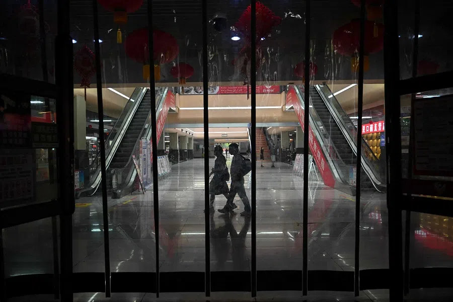 People walk at the Yiwu market in Yiwu, Zhejiang province, China, on 21 September 2024. (Adek Berry/AFP)