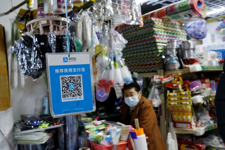 A QR code of digital payment device Alipay by Ant Group, an affiliate of Alibaba Group Holding, is seen at a grocery shop inside a market, in Beijing, China, 2 November 2020. (Tingshu Wang/Reuters)