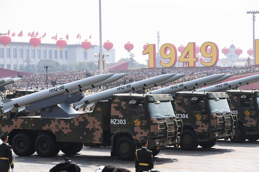 This file photo taken on 1 October 2019 shows military vehicles carrying HHQ-9B surface-to-air missiles participating in a military parade at Tiananmen Square in Beijing to mark the 70th anniversary of the founding of the People's Republic of China. (Greg Baker/AFP)