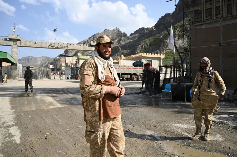 Taliban security personnel stand guard near the zero point at the Torkham International Border Crossing between Afghanistan and Pakistan, in Nangarhar province, on 20 April 2025. (Wakil Kohsar/AFP)