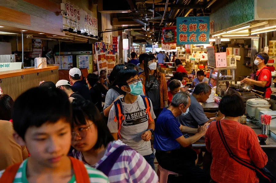 People walk inside a market in Keelung, Taiwan, on 19 August 2023. (Ann Wang/Reuters)