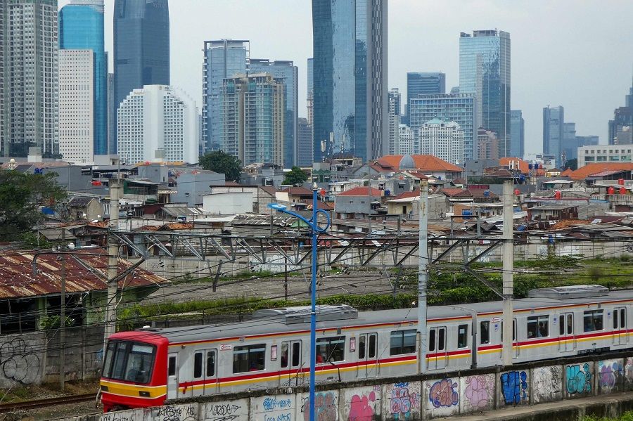Mochtar Riady urged ASEAN countries to work together to fully realise the huge potential of the region. In this photo taken on 14 April 2020, a commuter train is seen against the skyline of downtown Jakarta, Indonesia. (Bay Ismoyo/AFP)