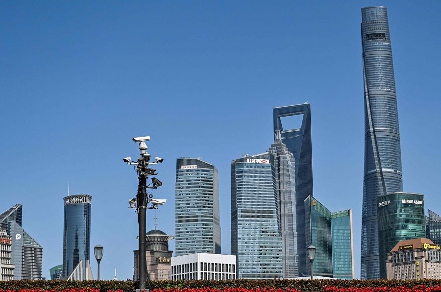 A tower of security cameras (centre, left) stands on The Bund past the Lujiazui financial district in the background, in Shanghai, China, on 23 May 2023. (Hector Retamal/AFP)