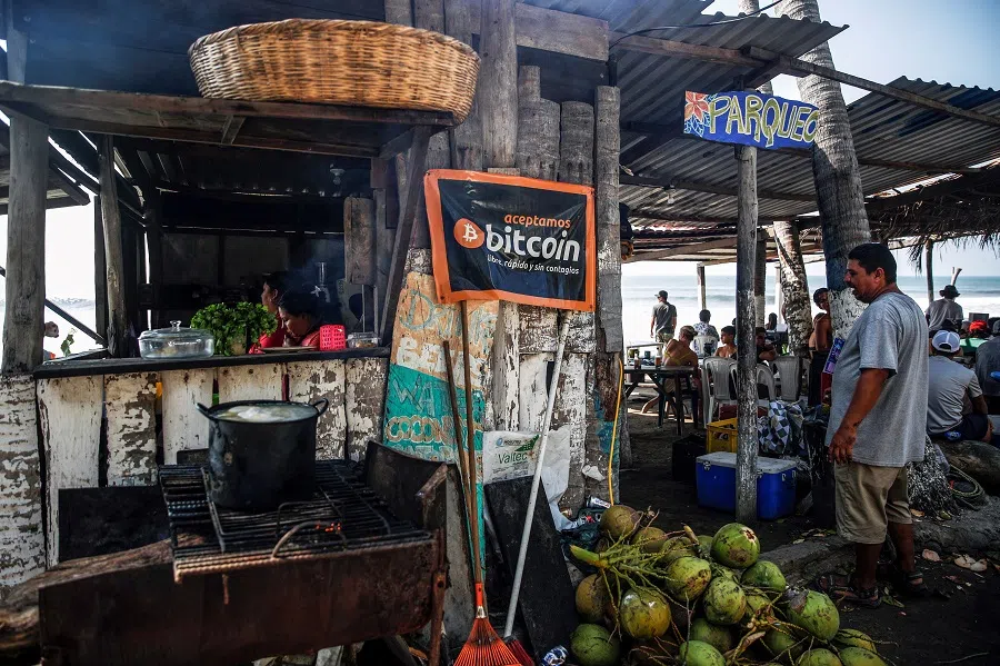 A banner that reads "We accept Bitcoin, free, fast and without contagion" is seen at a beach cafe on Punta Roca Beach in La Libertad, El Salvador, 25 April 2021. (Jose Cabezas/Reuters)