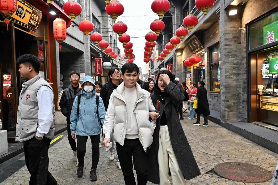 People visit Qianmen Street in Beijing, China, on 15 November 2024.