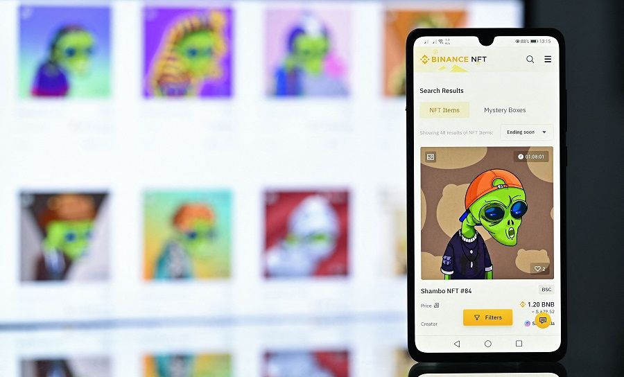 An illustration picture taken in London on 30 December 2021, shows an NFT (Non-Fungible Token) created by digital artist Zamblek named "Shambo NFT #84" on Binance NFT marketplace displayed on a mobile phone. (Justin Tallis/AFP)