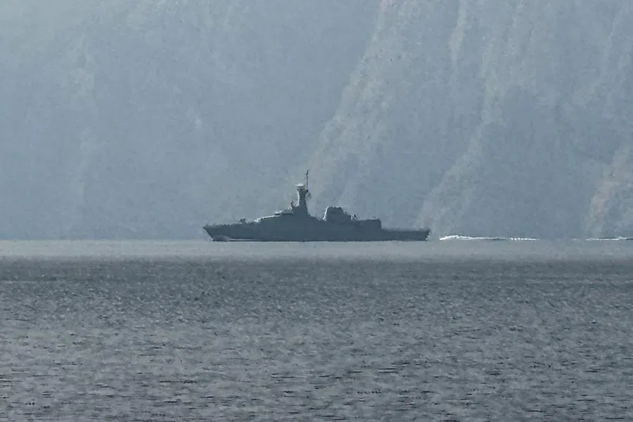 A navy vessel is seen sailing in the Strait of Hormuz, a vital waterway through which much of the world's oil and gas passes on 1 March 2026. (Sahar Al Attar/AFP)