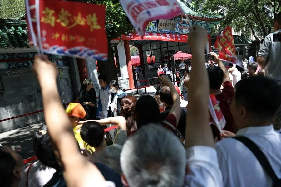 Parents cheer as students leave the venue after they finished their first exam as part of the annual national college entrance exam, or “gaokao”, in Beijing, China, on 7 June 2026.