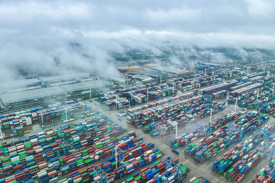 This aerial photo taken on 19 April 2023 shows shipping containers stacked at Zhoushan port in Ningbo, Zhejiang province, China. (AFP)
