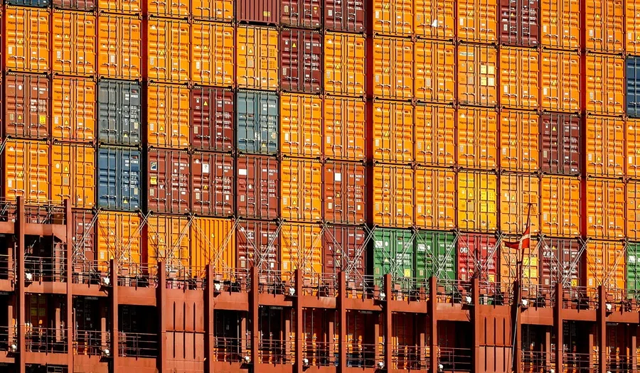 Containers stack on the deck of the Maribo Maersk container ship at a terminal wharf in Bremerhaven, Germany, on 13 August 2025. (Leon Kuegeler/Reuters)