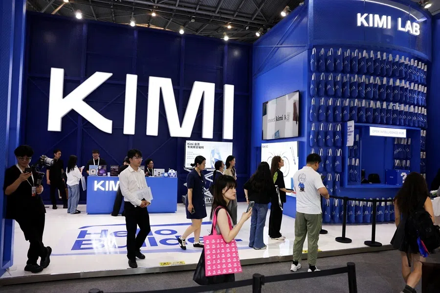 People walk past the Moonshot booth promoting its Kimi K3 AI model, during the World Artificial Intelligence Conference (WAIC) in Shanghai, China, on 17 July 2026.