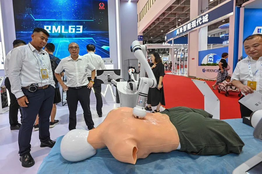 A massage robot is seen during the World Robot Conference in Beijing, China, on 21 August 2024. (Adek Berry/AFP)