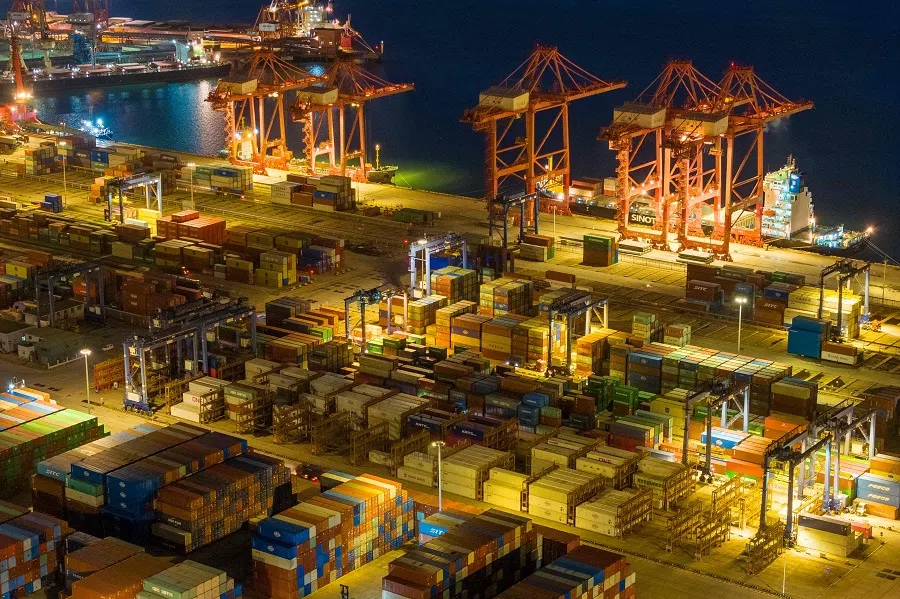 This aerial photo taken on 26 July 2023 shows cranes and shipping containers at Lianyungang port in Jiangsu province, China. (AFP)