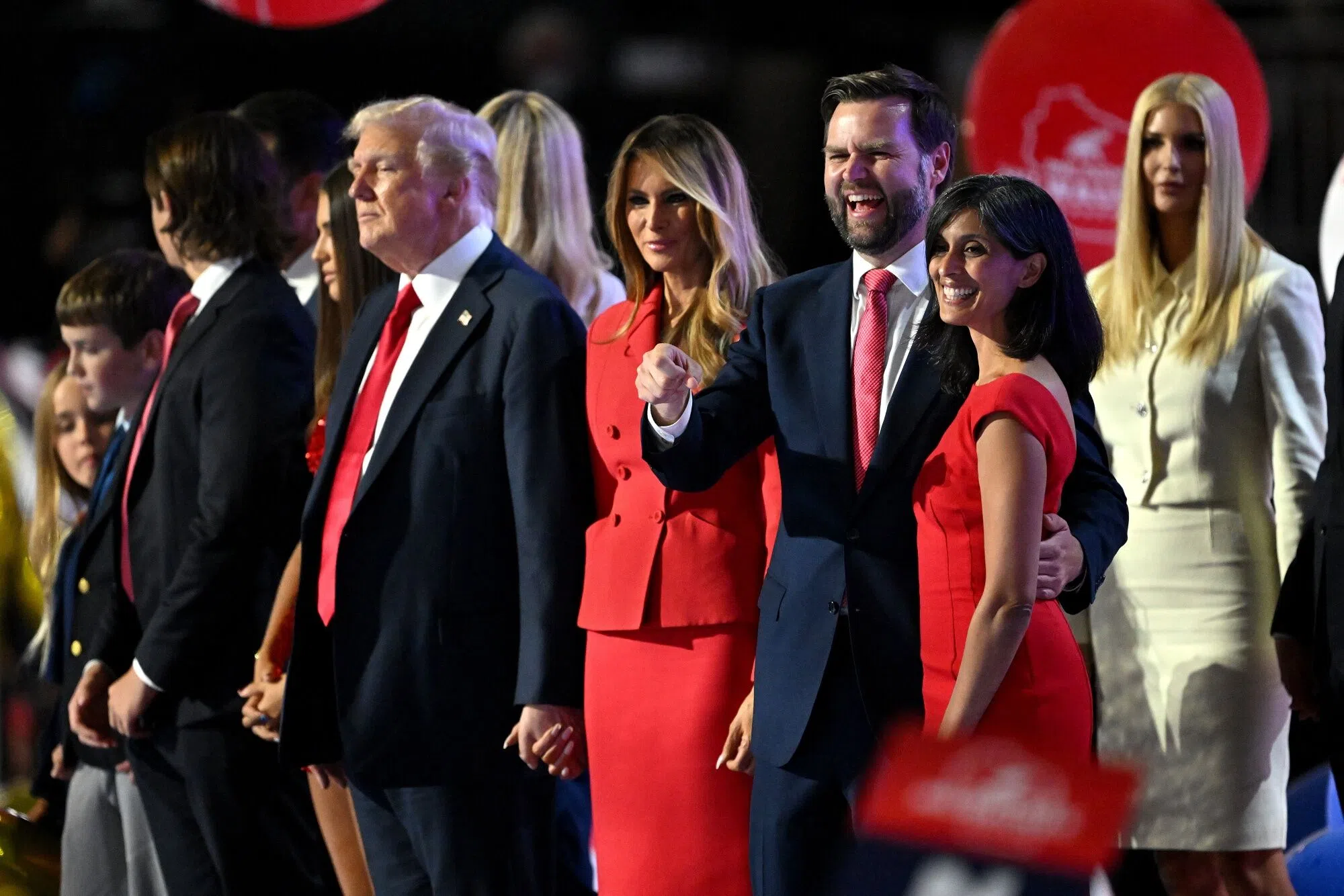 Donald Trump, from left, former First Lady Melania Trump, Senator JD Vance, a Republican from Ohio and Republican vice-presidential nominee, and his wife Usha Chilukuri Vance during the Republican National Convention (RNC) at the Fiserv Forum in Milwaukee, Wisconsin, US, on 18 July 2024. (David Paul Morris/Bloomberg)