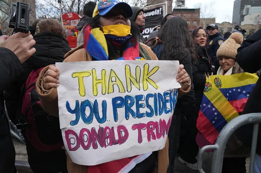 A supporter of US President Donald Trump demonstrates outside the Daniel Patrick Moynihan United States Courthouse after ousted Venezuelan president Nicolas Maduro attended his arraignment hearing on 5 January 2026 in New York. (Bryan R. Smith/AFP)