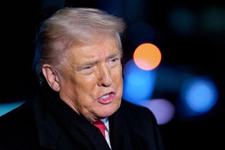 US President Donald Trump speaks to members of the media on the South Lawn of the White House before boarding Marine One in Washington, DC, US on 20 January 2026. (Aaron Schwartz/CNP/Bloomberg)