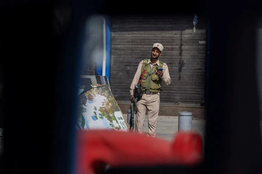 An Indian security force personnel stands guard on a street, following an attack on tourists near Pahalgam in Kashmir on 29 April 2025. (Adnan Abidi/Reuters)