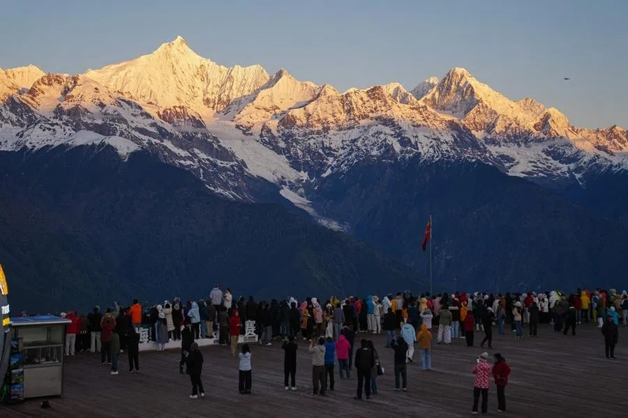 People at the Meili Snow Mountains in Yunnan, China, 13 May 2026.