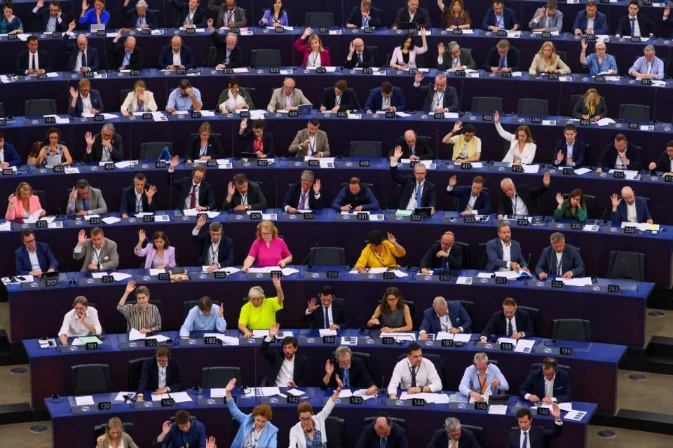 Members of the EU Parliament vote during a plenary session at the European Parliament in Starsbourg, France, 13 June 2023. (Yves Herman/Reuters)