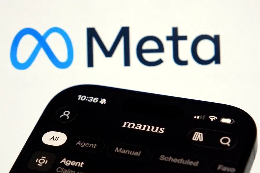 The Manus AI agent app is displayed on a mobile phone near the logo of US tech giant Meta, in this illustration picture taken on 28 April 2026. (Florence Lo/Illustration/Reuters)