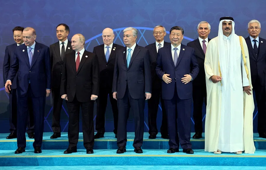 Participants of Shanghai Cooperation Organization (SCO) summit, including Turkish President Tayyip Erdogan, Russian President Vladimir Putin, Kazakh President Kassym-Jomart Tokayev, Chinese President Xi Jinping and Emir of Qatar, Sheikh Tamim bin Hamad bin Khalifa Al Thani, attend a photo ceremony in Astana, Kazakhstan, on 4 July 2024. (Sergei Savostyanov/Sputnik/Pool via Reuters)