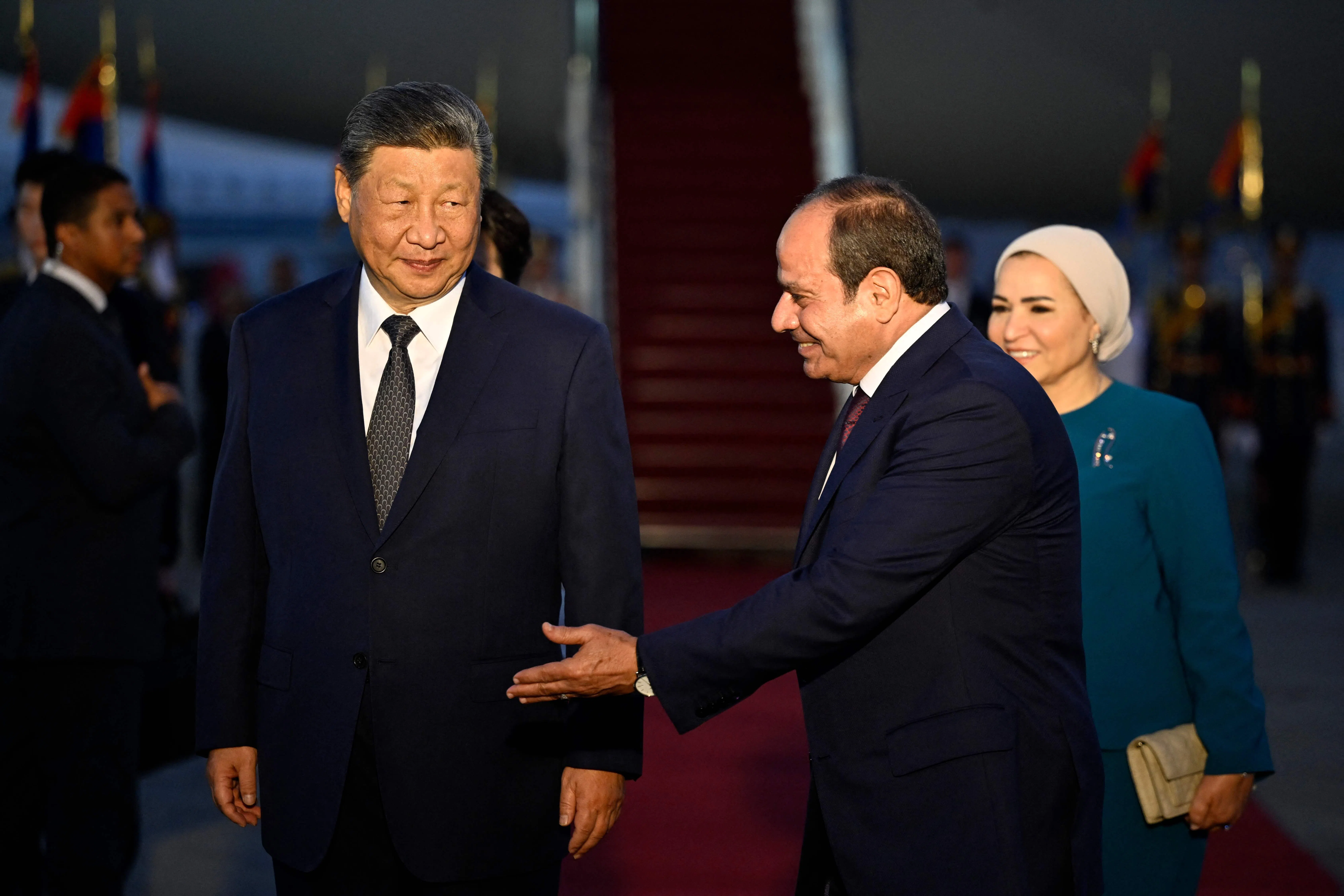 Egypt's President Abdel Fattah al-Sisi (centre) and his wife Entissar Amer (right) welcome China's President Xi Jinping at the Cairo International Airport on 1 September 2026.