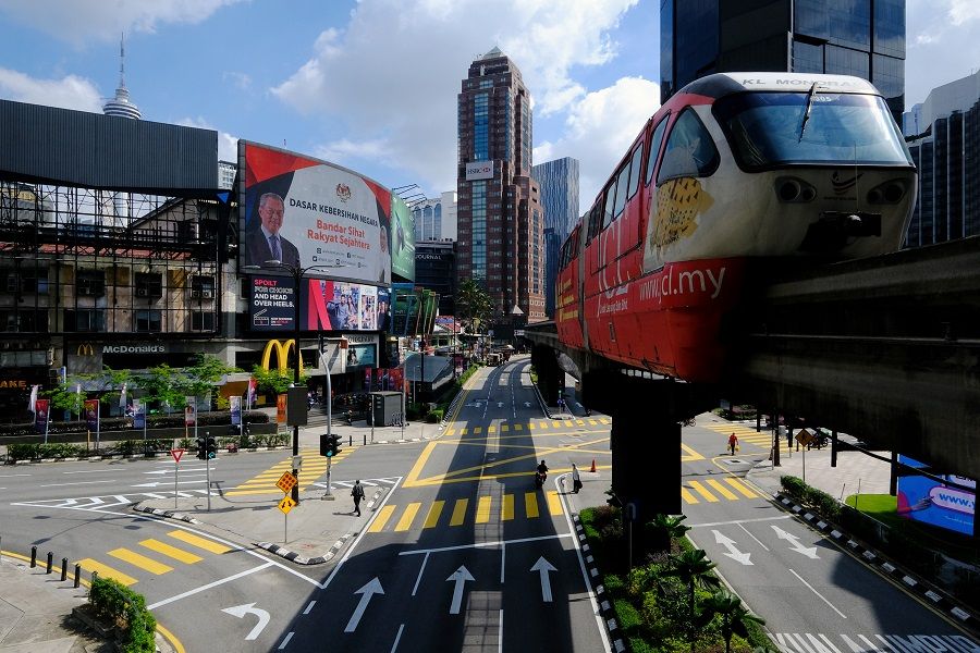 A rapidKL train travels along an elevated track above streets in Kuala Lumpur, Malaysia on 1 June 2021. (Samsul Said/Bloomberg)