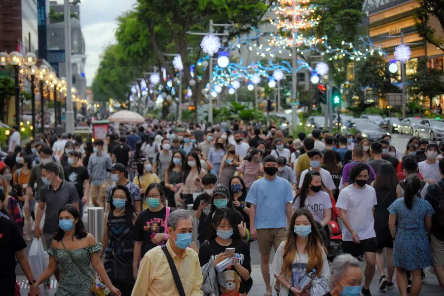 People cross a traffic junction along Orchard Road on 19 December 2020. (SPH)