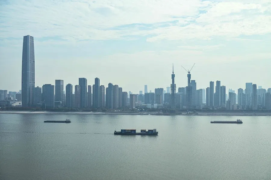 Cargo ships sail on the Yangtze River in Wuhan, Hubei province, China, on 22 December 2024. (Hector Retamal/AFP)