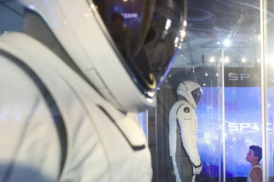 A visitor examines space suits inside the SpaceX exhibit at the Great American State Fair on the National Mall in Washington, DC, US, on 25 June 2026.