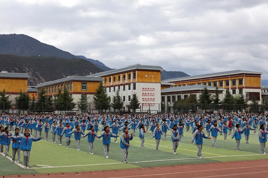 Students in the schoolyard at Nyingchi City Bayi District Middle School, during a government-organised tour, in Nyingchi, Tibet Autonomous Region, China, 31 March 2025. (Go Nakamura/Reuters)