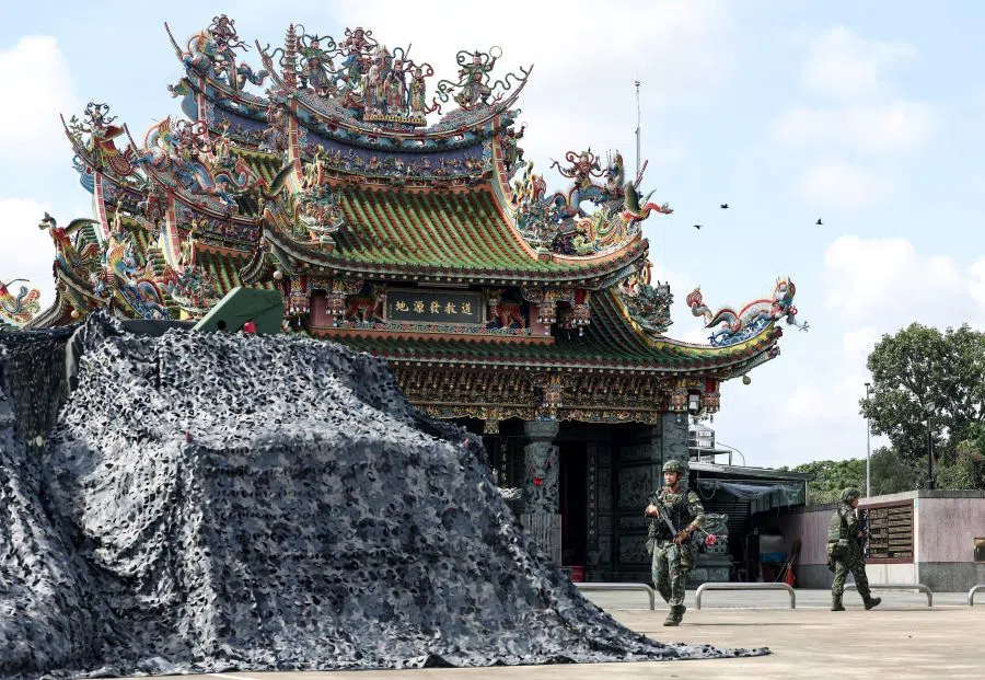 A covered Taiwanese military truck and a camp are seen at a local temple during the annual Han Kuang exercises in Tainan on 14 July 2025.