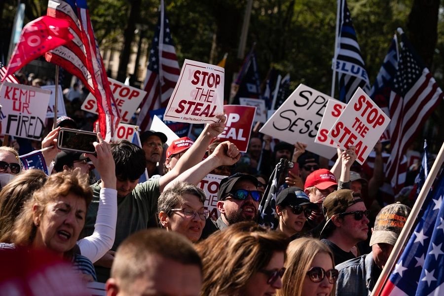 Protesters rally outside the Georgia State Capitol against the results of the 2020 Presidential election on 21 November 2020 in Atlanta, Georgia. (Elijah Nouvelage/Getty Images/AFP)