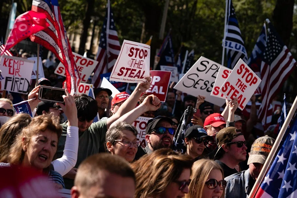 Protesters rally outside the Georgia State Capitol against the results of the 2020 Presidential election on 21 November 2020 in Atlanta, Georgia. (Elijah Nouvelage/Getty Images/AFP)