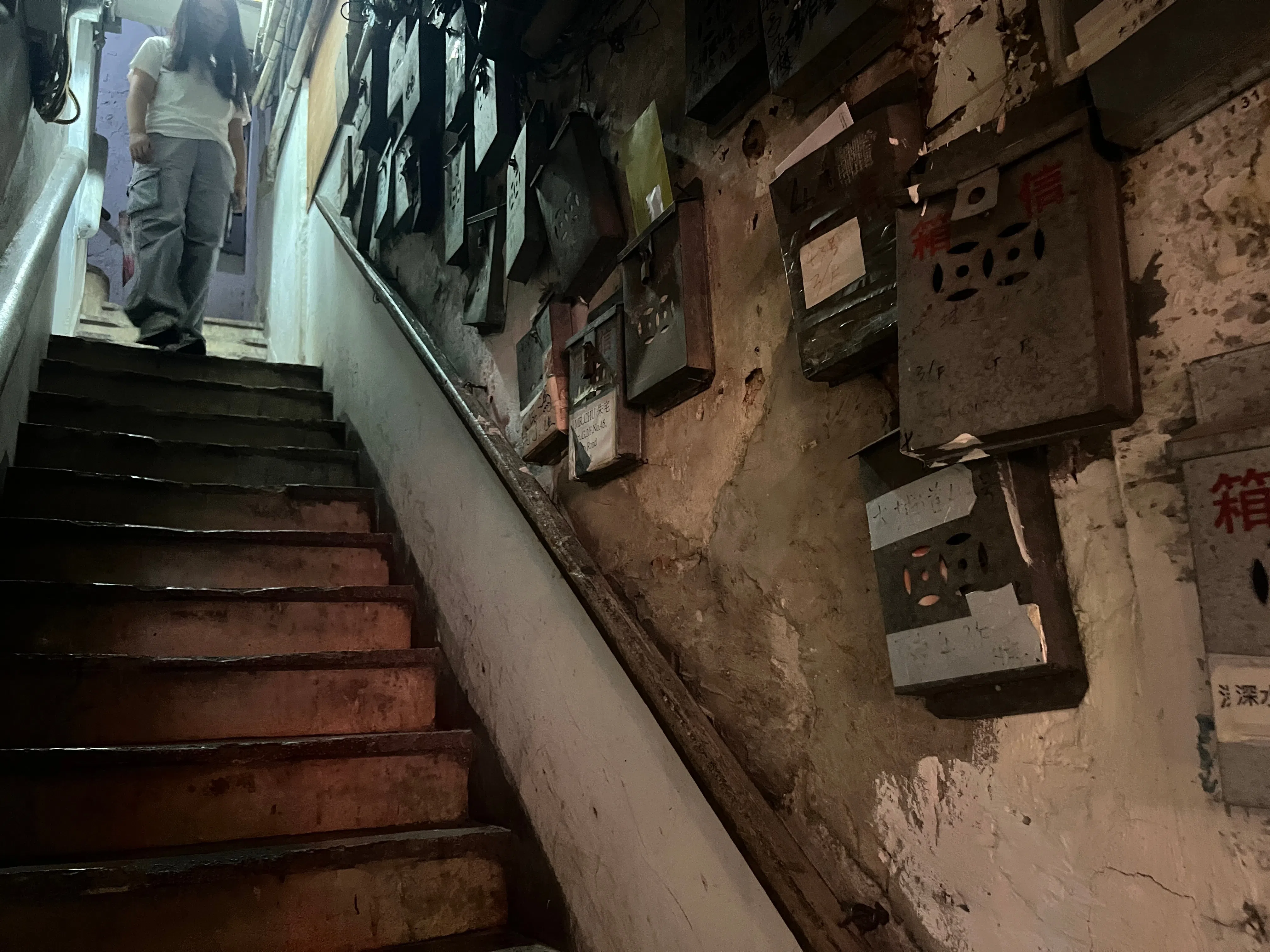 The well-worn stairs at a building housing several floors of some hundreds of substandard subdivided units and coffin homes in Cheung Sha Wan, Hong Kong, in October 2024. (SPH Media)