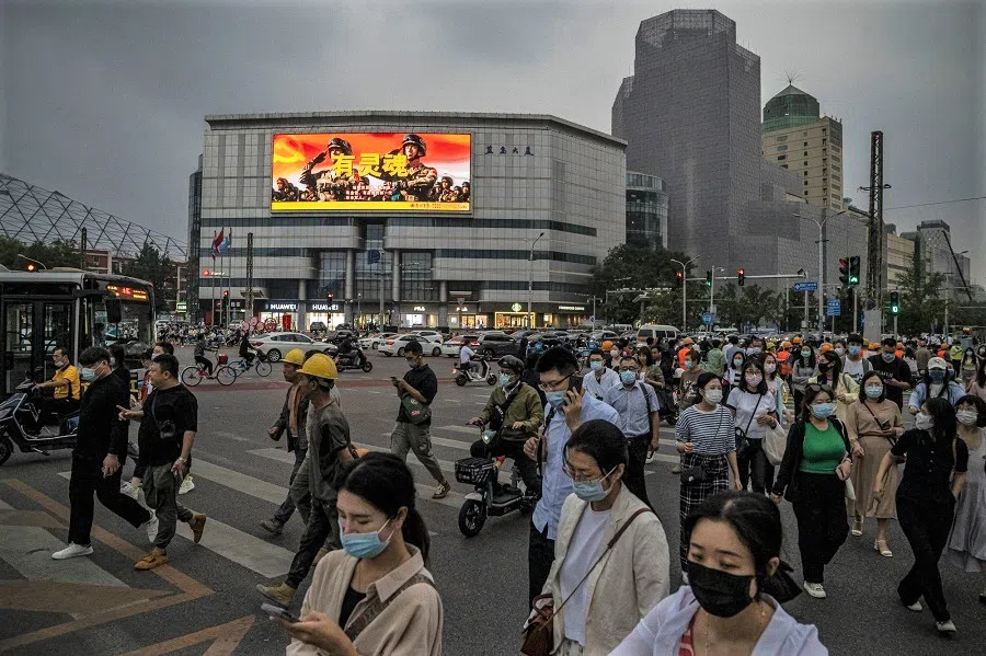 A screen displaying a People's Liberation Army (PLA) advertisement at a crossroad in Beijing, China, on 30 August 2022. (Bloomberg)