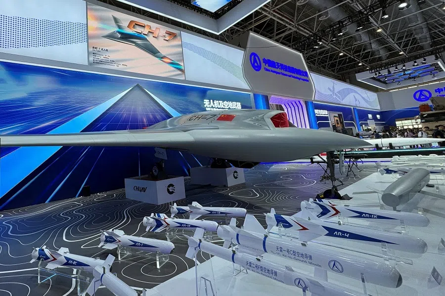 A model of CH-7 stealth unmanned aircraft is displayed alongside mockups of air-to-ground missiles at the China International Aviation and Aerospace Exhibition, or Airshow China, in Zhuhai, Guangdong province, China, 13 November 2024.