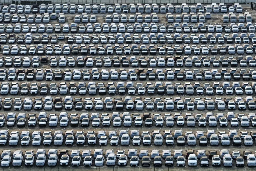 An aerial view shows Chinese-made cars parked at a port in Nanjing, in China’s eastern Jiangsu province, on 11 July 2025, before being loaded onto a ship for export.