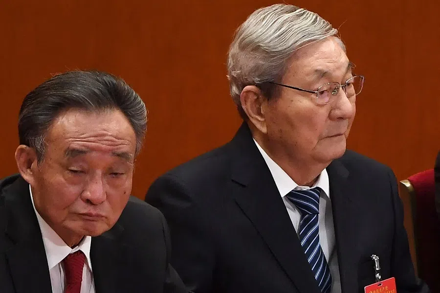 Former Chinese Premier Zhu Rongji and former National People's Congress chairman Wu Bangguo listen to speeches during the closing session of the 19th Communist Party Congress at the Great Hall of the People in Beijing on 24 October 2017.