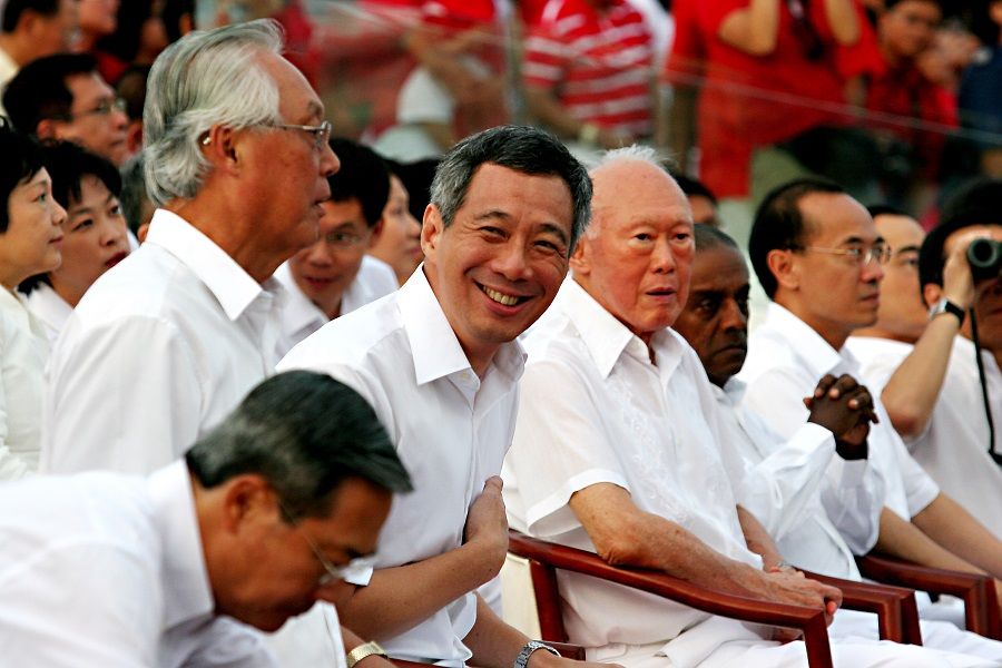 Members of the cabinet settle in after they arrive at their seats, including (from left) Senior Minister Goh Chok Tong, Prime Minister Lee Hsien Loong and Minister Mentor Lee Kuan Yew at Singapore's National Day Parade in 2007. (SPH Media)