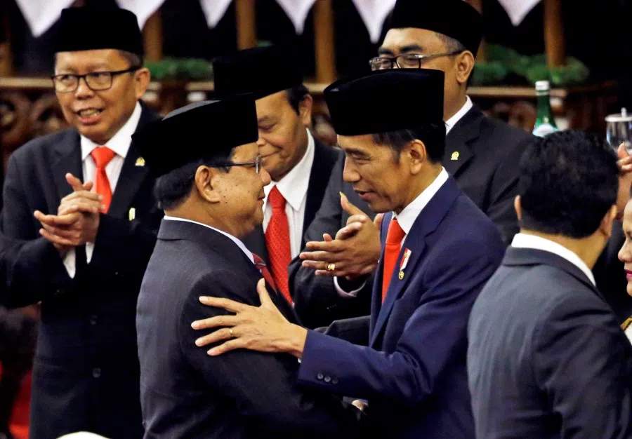 Indonesian President Joko Widodo is congratulated by the Gerindra Party Chairman Prabowo Subianto, who was his former rival in April's election, after his presidential inauguration for the second term, at the House of Representatives building in Jakarta, Indonesia, 20 October 2019. (Achmad Ibrahim/Pool via Reuters)